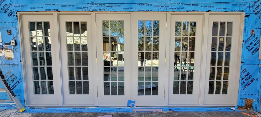 Multi-panel glazed terrace door assembly during installation.